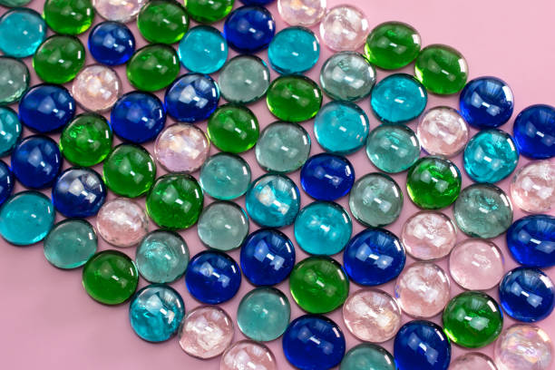 A vibrant backdrop of colorful glass drops creates a captivating and abstract texture, offering an ideal space for adding your text or message.