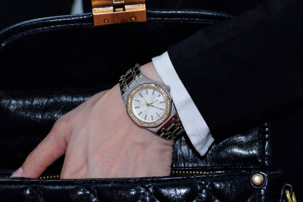 Hand holding vintage swiss made wrist watch