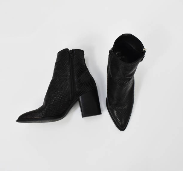 istock Black chunky heels boots isolated on white, reptile leather ankle boots for women, basic snake skin fall boots 1718470029