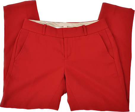 Red office pants neatly folded on a clean white surface