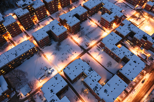 Aerial view of a residential area with apartment buildings on a winter evening in Stockholm, Sweden.