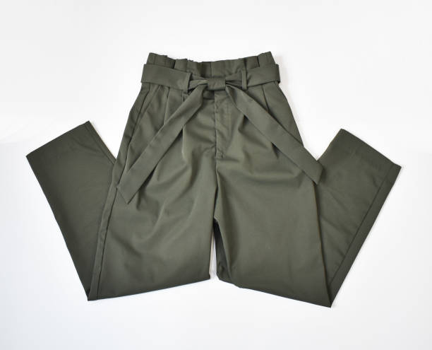 istock Folded khaki green pants with belt flat lay on white 1718472923