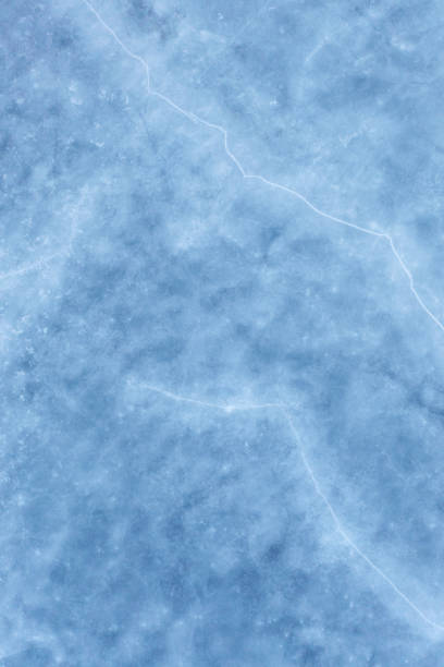 Aerial view of ice on a frozen lake in winter.