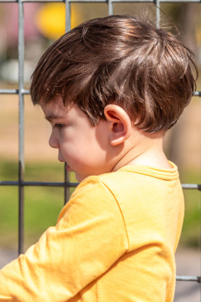 istock Little boy enjoying outdoors on a sunny day. 1718485697