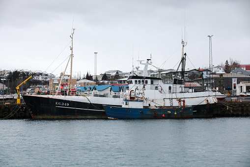 Hafnarfjordur, Iceland - April 4, 2017: Industrial fishing boats are moored in Hafnarfjordur harbour. It is a small port town located on the southwest coast of Iceland