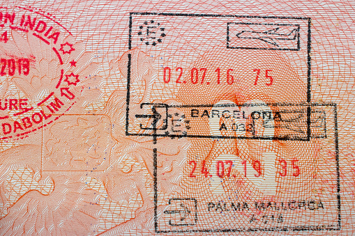 Travel passports often contain a collection of stamps, including entry and exit stamps, which signify a traveler's movement across international borders. These stamps document the processes of emigration and immigration, representing the essence of international tourism and the diverse experiences of globetrotters.