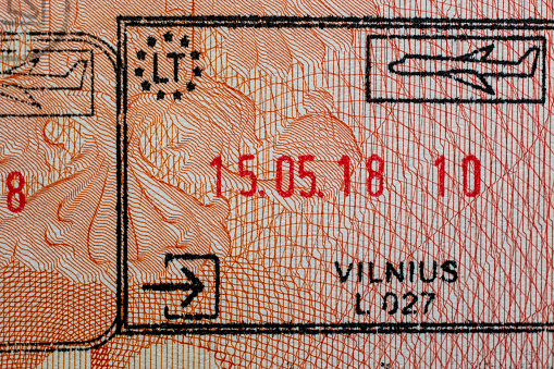 Travel passports often contain a collection of stamps, including entry and exit stamps, which signify a traveler's movement across international borders. These stamps document the processes of emigration and immigration, representing the essence of international tourism and the diverse experiences of globetrotters.
