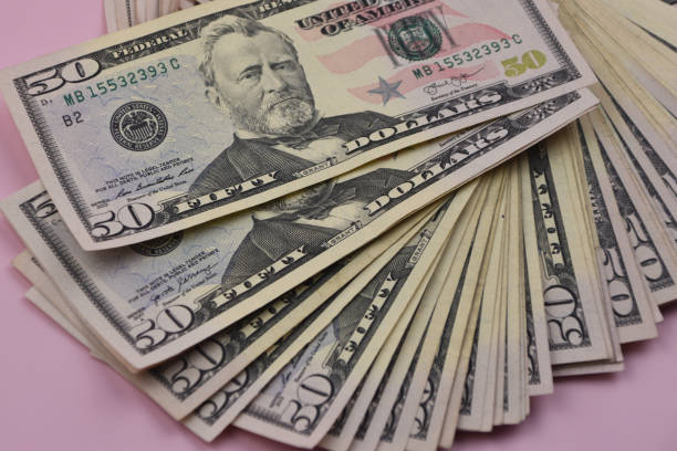 istock A lot of money, 50 dollar bills, American dollars, fifty dollar banknotes background 1718493473