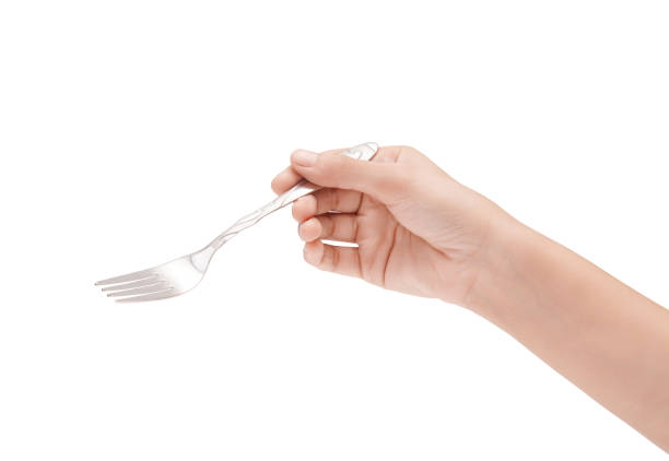 istock Female Hand Holding A Silver Stainless Fork Closeup Photo Isolated On White Background 1718494021