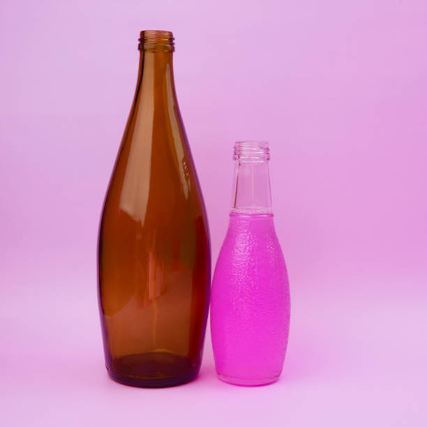 istock Colorful glass bottles, unusual background 1718502906