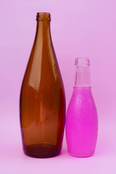 istock Colorful glass bottles, unusual background 1718502922