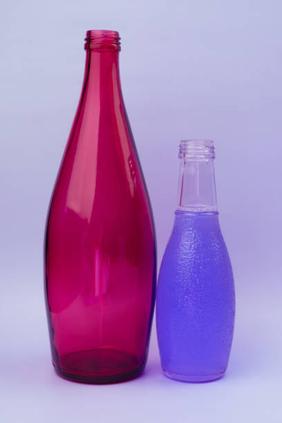istock Colorful glass bottles, unusual background 1718503478