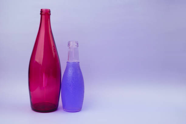 istock Colorful glass bottles, unusual background 1718503485