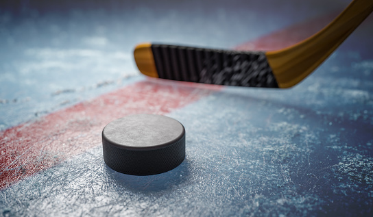 Hockey puck on ice at stadium. 3D rendered illustration.