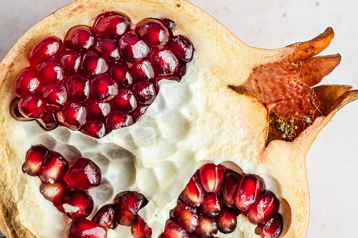 Image of half Pomegranate showing the seeds. Close-up of hal cut Pomegranate fruit.