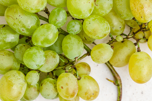 Top view fresh ripe green grapes. Grape vine with grapes cluster.