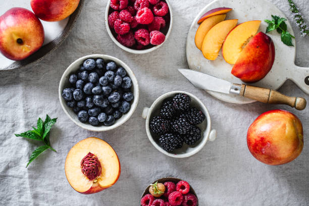 istock Ingredients for preparing healthy fruit salad on kitchen table 1718516599