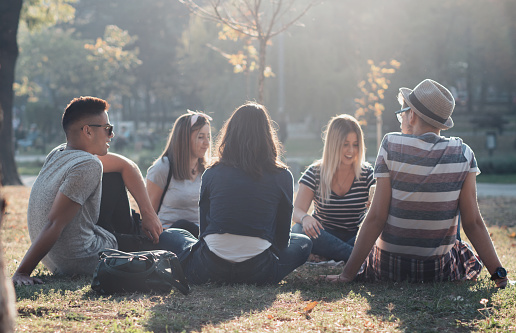 Diverse group off friends laughing outdoors