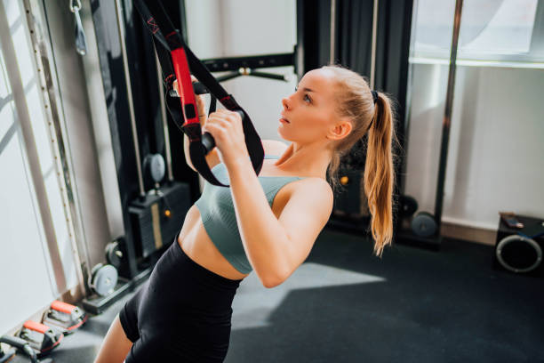 istock Young woman training in the gym 1718525975