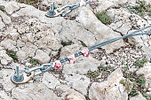 Fastening of suspension bridge braces in rock with anchors