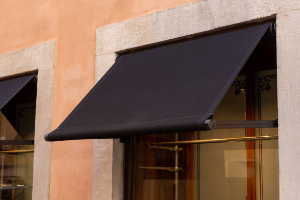 istock Premium black awning, outside a shop or restaurant, presenting an excellent space for logo mockup promotion 1718533675