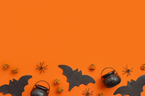 istock Halloween decor on an orange black background. Flat lay top view 1718534385