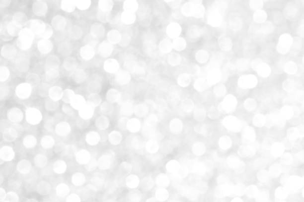 istock White and gray bokeh background. Celebration background concept. 1718545590