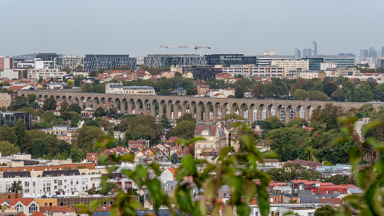 Distant view of the Vanne aqueduct, located on the border of Arcueil and Cachan, France, in the Val-de-Marne department, in the Ile-de-France region