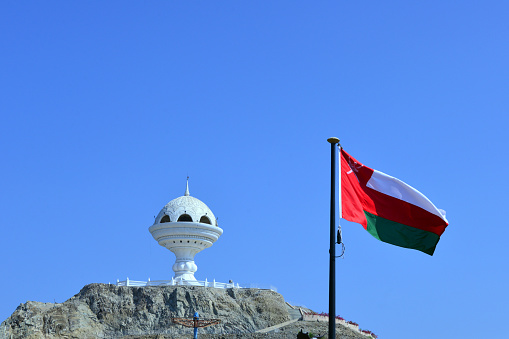 Riyam, Muscat, Oman: Riyam Censer and Omani flag - giant ornamental incense burner, built on a hill above Riyam park in honor of Oman's 20th National Day and offers great views of the harbor and coast. It celebrates Oman’s history of frankincense.