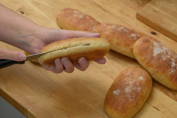 istock Cut the rolls in half for sandwiches 1718564665