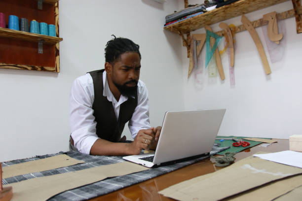 istock Designer looking for new design on laptop 1718573644