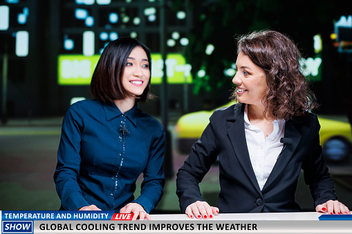 Journalists present global cooling trend as innovation to adjust temperature and weather forecast, live tv transmission. Presenters team doing reportage on new technology trend.