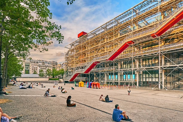 Paris Paris, France - July 11, 2023: Pedestrians on the Place Georges Pompidou in front of  the Center Pompidou in the evening. pompidou center stock pictures, royalty-free photos & images