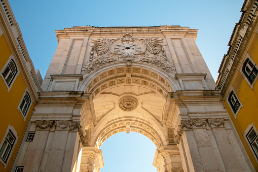 The iconic arch on Praca do Comercio in Lisbon, Portugal, stands as a historic and architectural masterpiece, serving as a symbol of the city's grandeur and rich heritage.