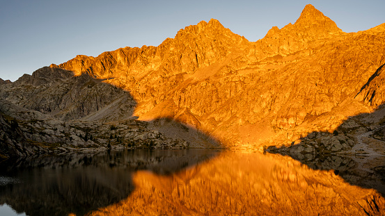 Sunrise at Lac Vert in the Mercantour National Park in summer around the Valmasque refuge in the Alps