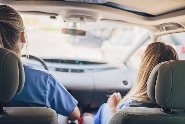 istock Two female nurses colleagues sharing a car ride to work 1718601490