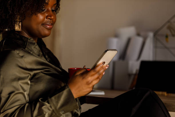 istock Young woman on a coffee break responding to text messages 1718609959