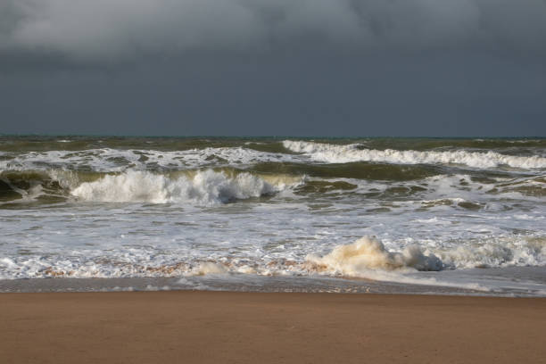 istock Empty wild sandy beach, Atlantic Ocean seascape, sea waves, beautiful cloudscape, dramatic landscape, travel content, Lisbon, Portugal 1718619840