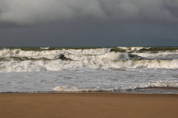 istock Empty wild sandy beach, Atlantic Ocean seascape, sea waves, beautiful cloudscape, dramatic landscape, travel content, Lisbon, Portugal 1718619851
