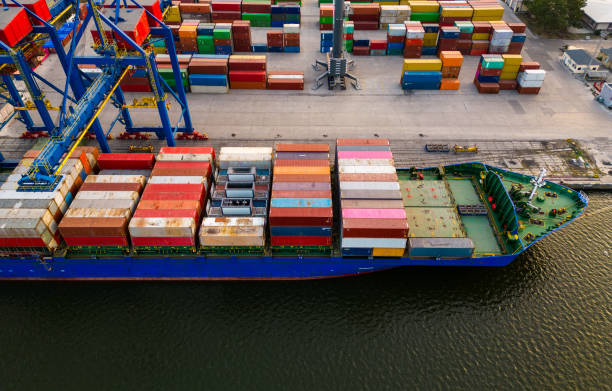 aerial view of a container ship in terminal at the port, where massive containers await their journey stock photo
