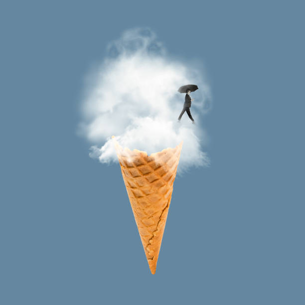 A vanilla ice cream cone against a clear blue sky