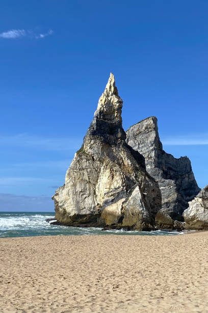 istock Empty wild sandy beach, Atlantic Ocean seascape, sea waves, beautiful cloudscape, dramatic landscape, travel content, Lisbon, Portugal 1718678573