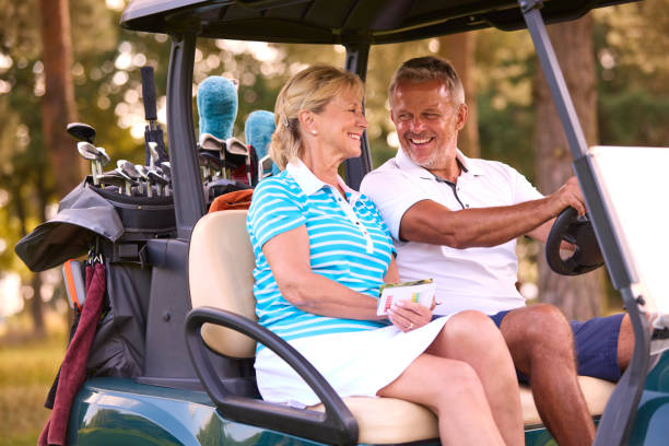 istock Senior Couple Sitting In Buggy On Golf Course Marking Score Card Together 1718679140