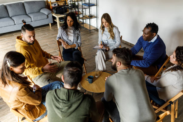 istock Diverse group of people discussing emotions and feeling during a therapy session 1718681275