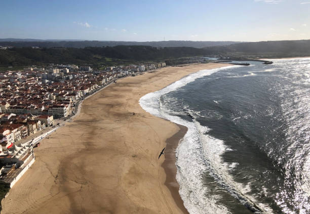 istock Top view of a large empty sandy shore of the Atlantic ocean 1718681814