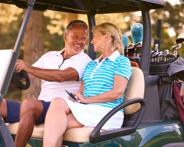 istock Senior Couple Sitting In Buggy On Golf Course Marking Score Card Together 1718683447