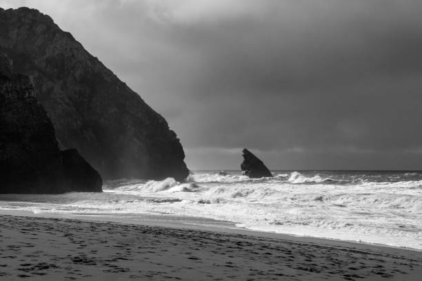 istock Empty wild sandy beach, Atlantic Ocean seascape, sea waves, beautiful cloudscape, dramatic landscape, travel content, Lisbon, Portugal 1718692253