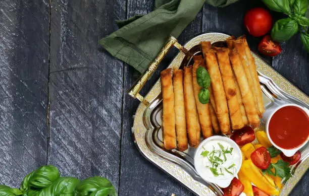 traditional appetizer borek with sauces on the table