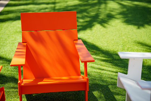 A large umbrella provides relaxing shade to a beautiful garden patio.