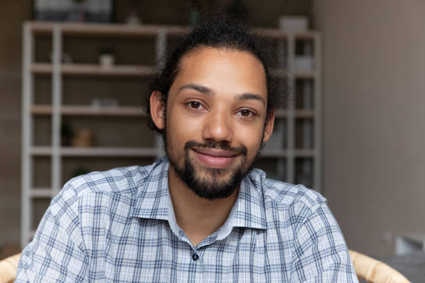 istock Head shot portrait handsome African American man looking at camera 1718704639